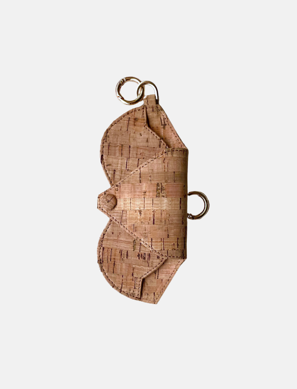 Minimalist cork leather sunglasses case with scalloped edges and metal rings for attachment