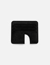 Minimalist black leather card holder with four slots and curved cutout on white background