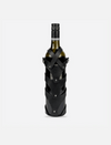 Green wine bottle wrapped in black stitched upcycled leather case with metal studs closure