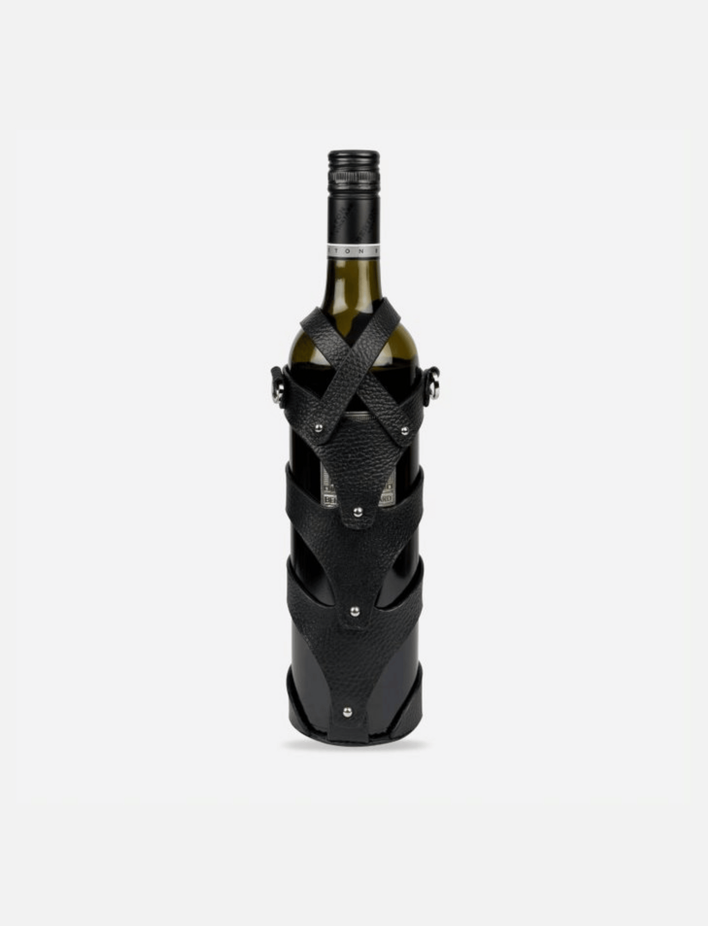 Green wine bottle wrapped in black stitched upcycled leather case with metal studs closure
