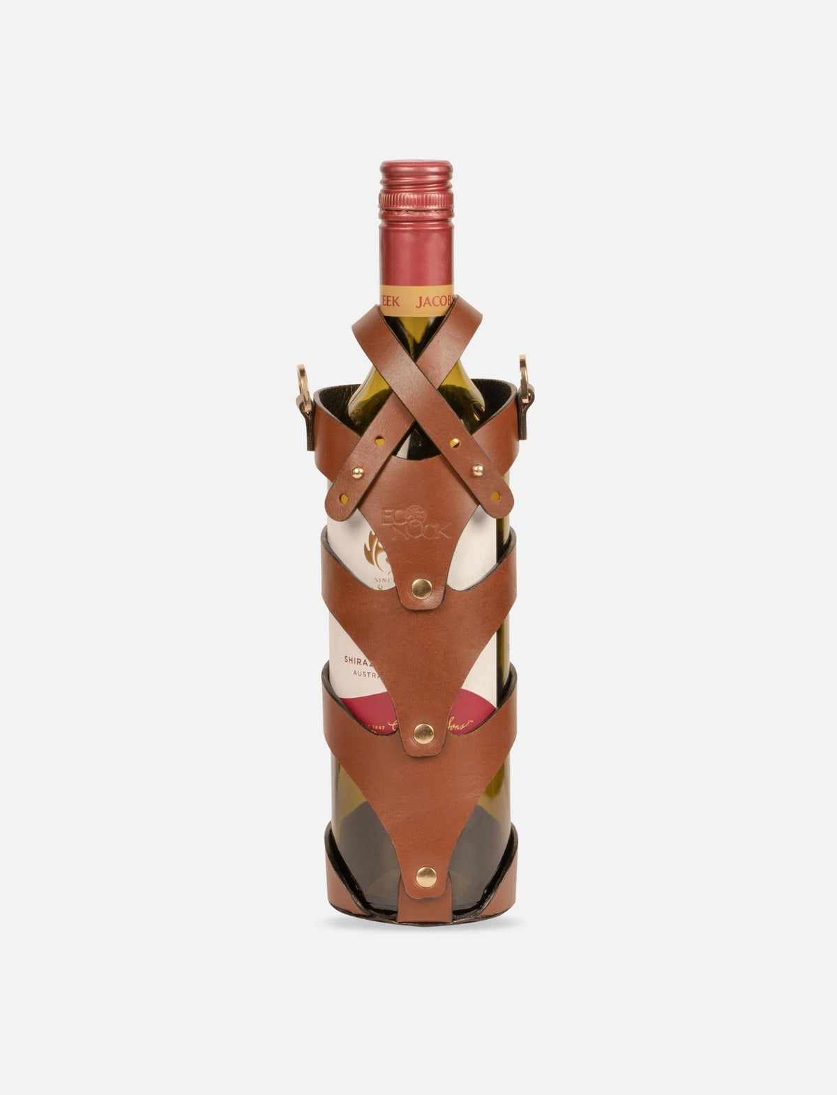 Tan leather stitched wine bottle holder case with brass rivets on red wine bottle