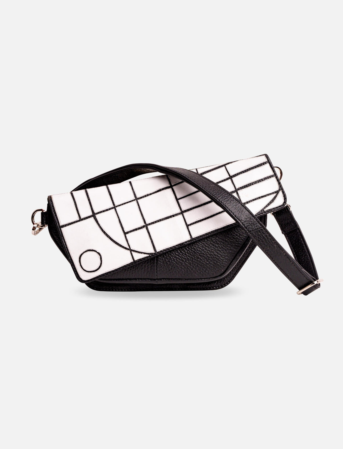 Black and white leather crossbody bag with geometric pattern flap and adjustable strap