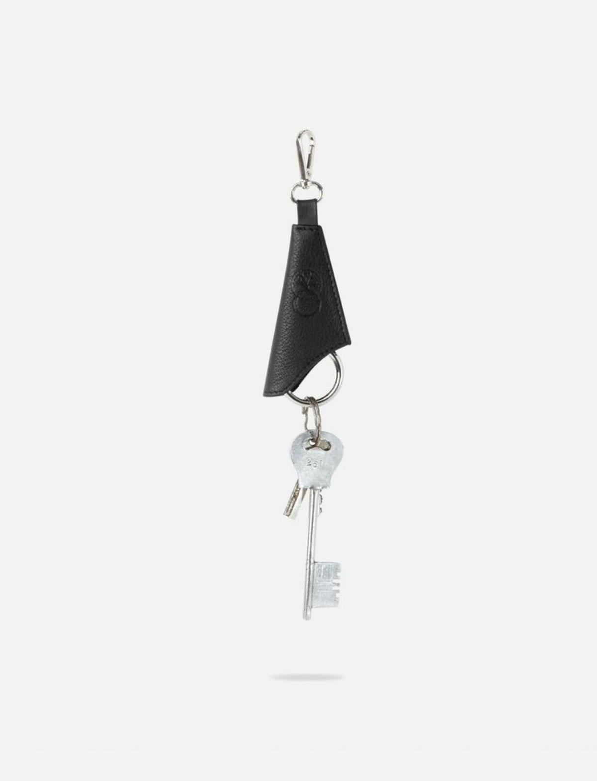Black upcycled leather keychain with metal attachment and vintage silver keys, handcrafted in India