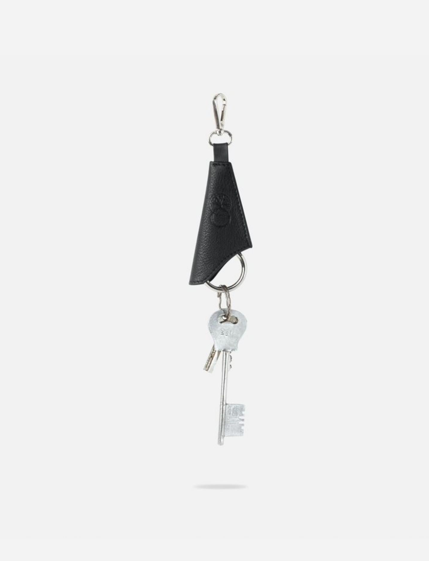 Black upcycled leather keychain with metal attachment and vintage silver keys, handcrafted in India