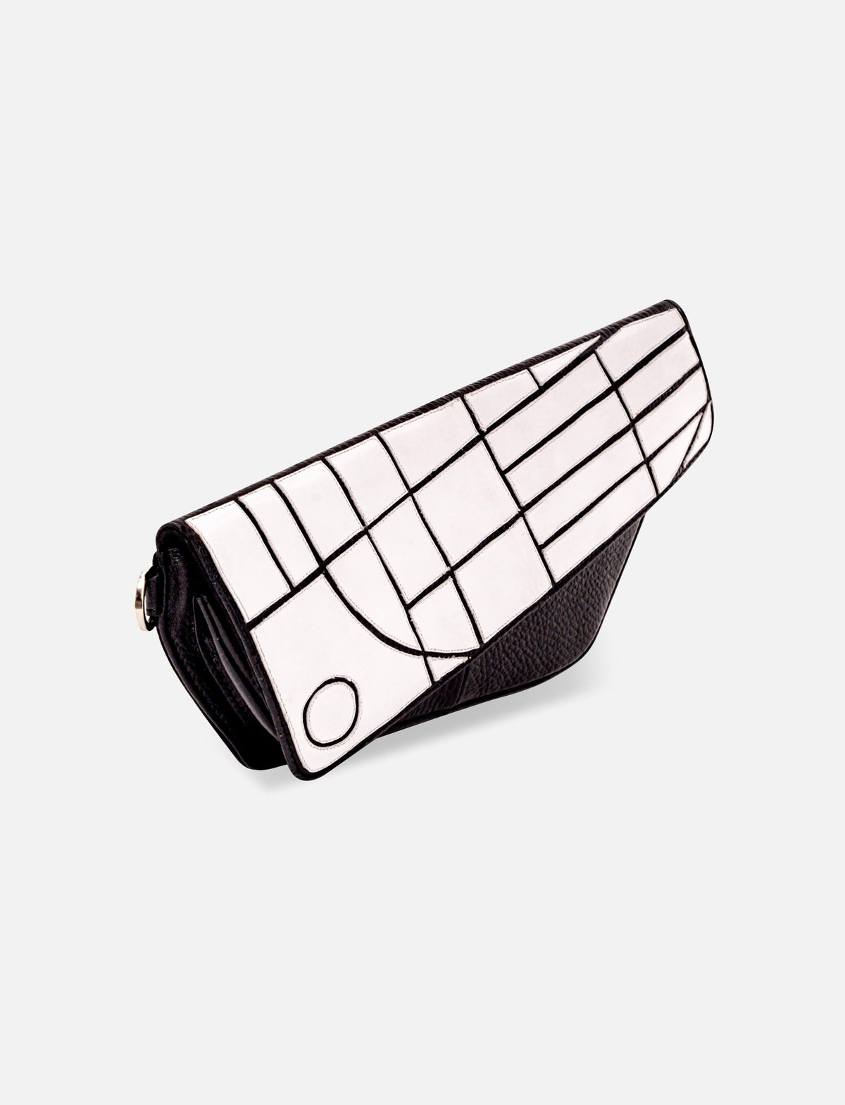 Black and white geometric patterned leather clutch purse with flap closure on white background