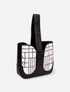 Black leather handbag with wide handle and white geometric pattern on front