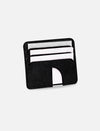 Black leather minimalist card holder with white cards on white background