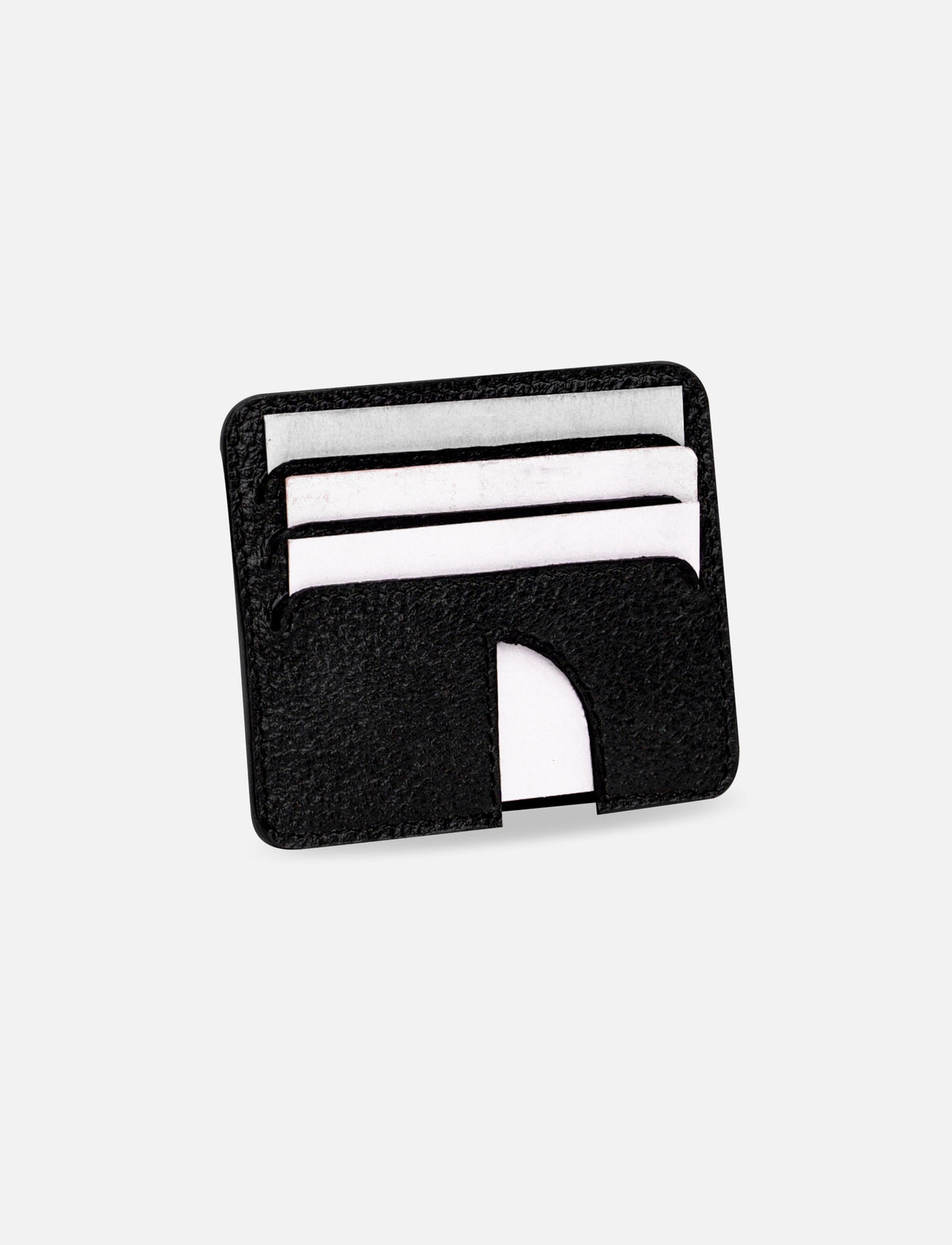 Black leather minimalist card holder with white cards on white background