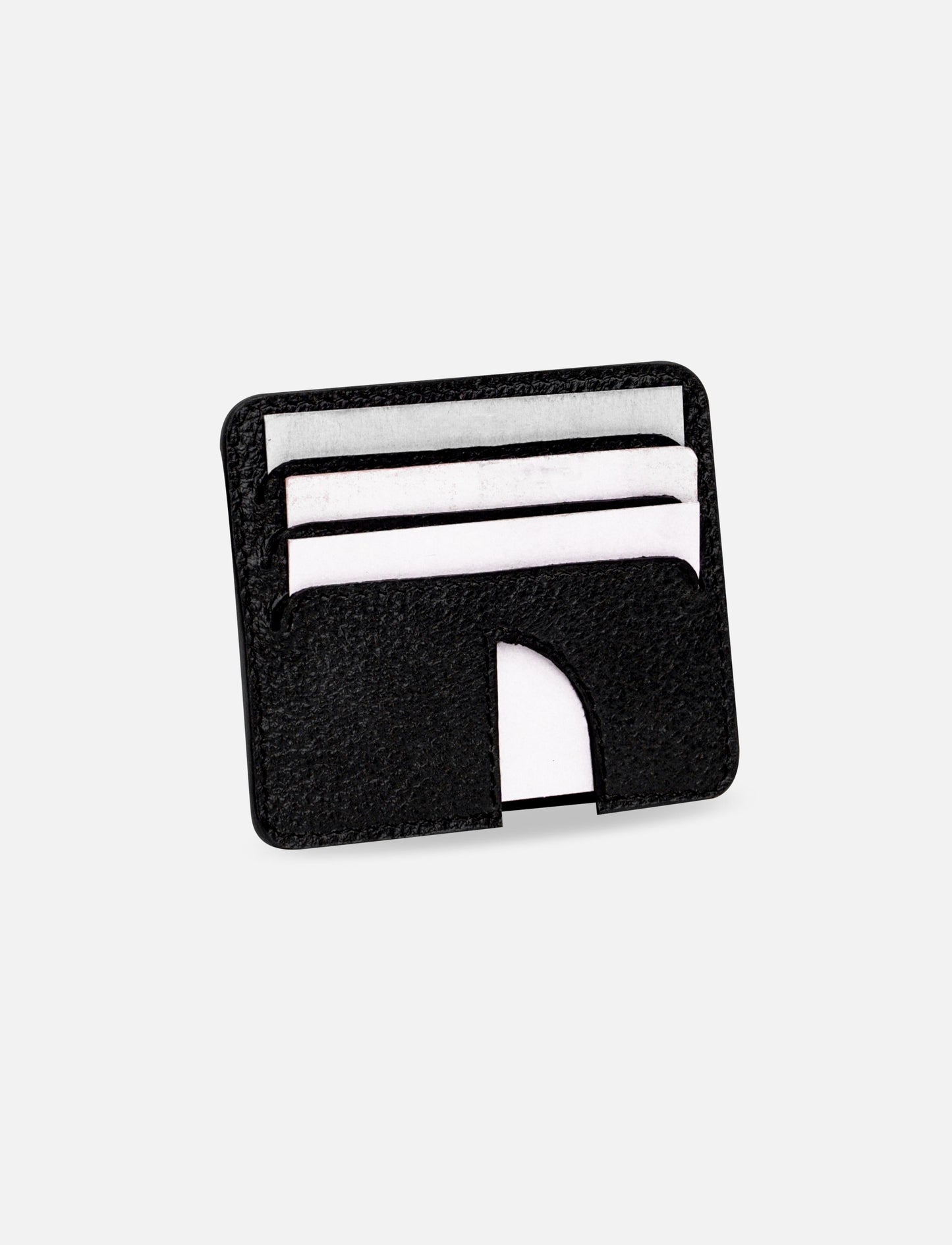 Black leather minimalist card holder with white cards on white background