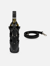 Black upcycled leather wine case strapped on wine bottle with detachable crossbody strap on white background