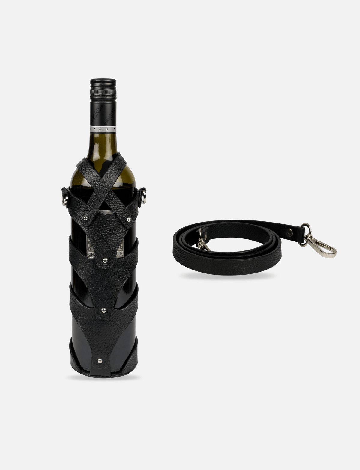 Black upcycled leather wine case strapped on wine bottle with detachable crossbody strap on white background