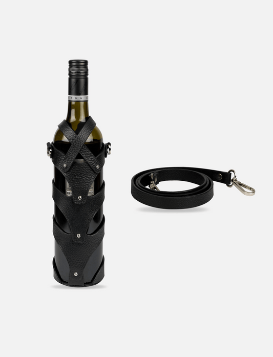 Black upcycled leather wine case strapped on wine bottle with detachable crossbody strap on white background