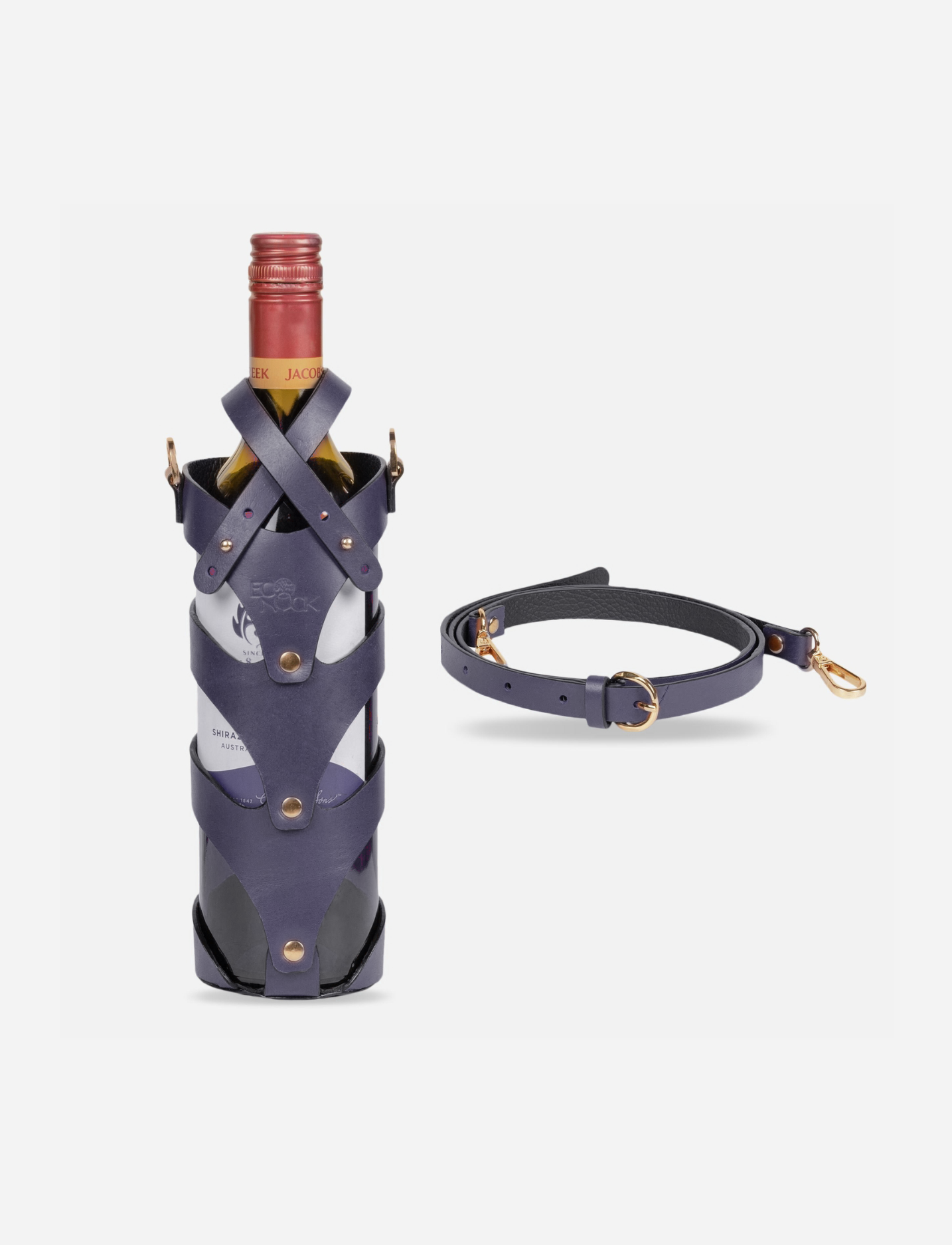 Blue leather wine bottle holder with gold rivets and detachable strap on white background