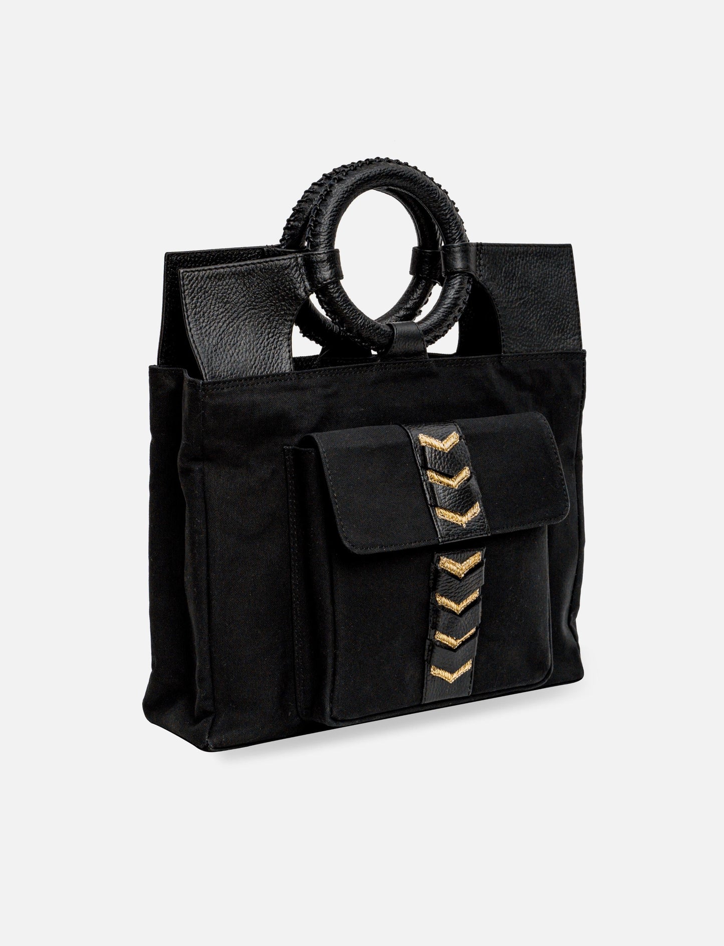 Black tote bag with leather handles and front pocket featuring gold chevron embroidery