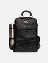 Black leather backpack with gold rings and side pocket holding a silver stainless steel thermos