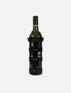 Wine bottle secured in black upcycled leather stitched case with metal rivets on white background