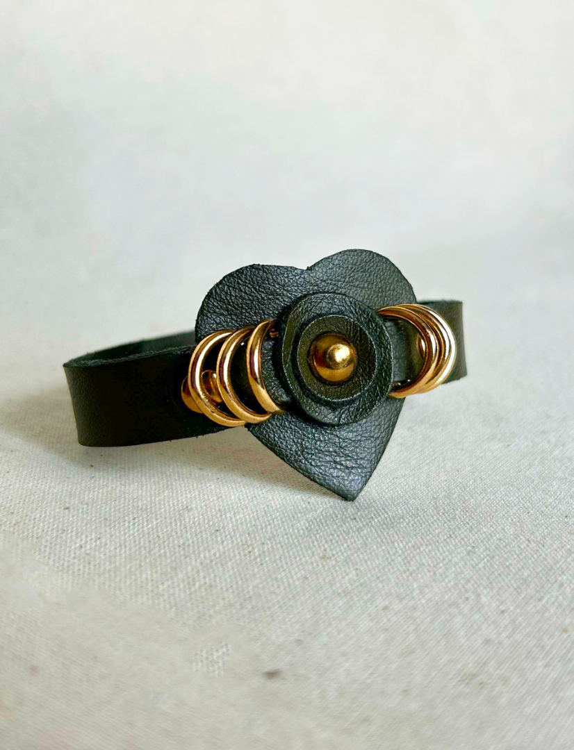 Handcrafted timeless olive green vegan leather cuff bracelet with gold rings and heart detail