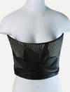 Black leather corset with gold embroidery and leaf-like design on mannequin torso