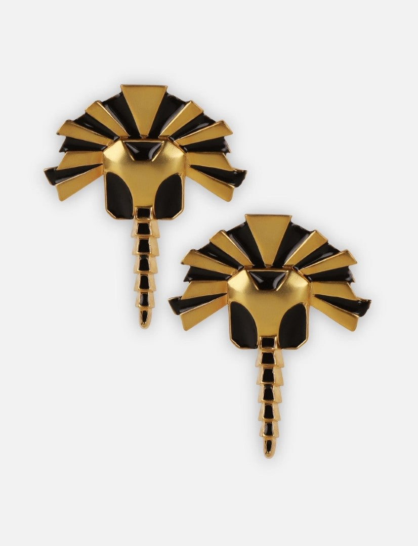 Pair of gold and black enamel earrings shaped like stylized lion heads with manes