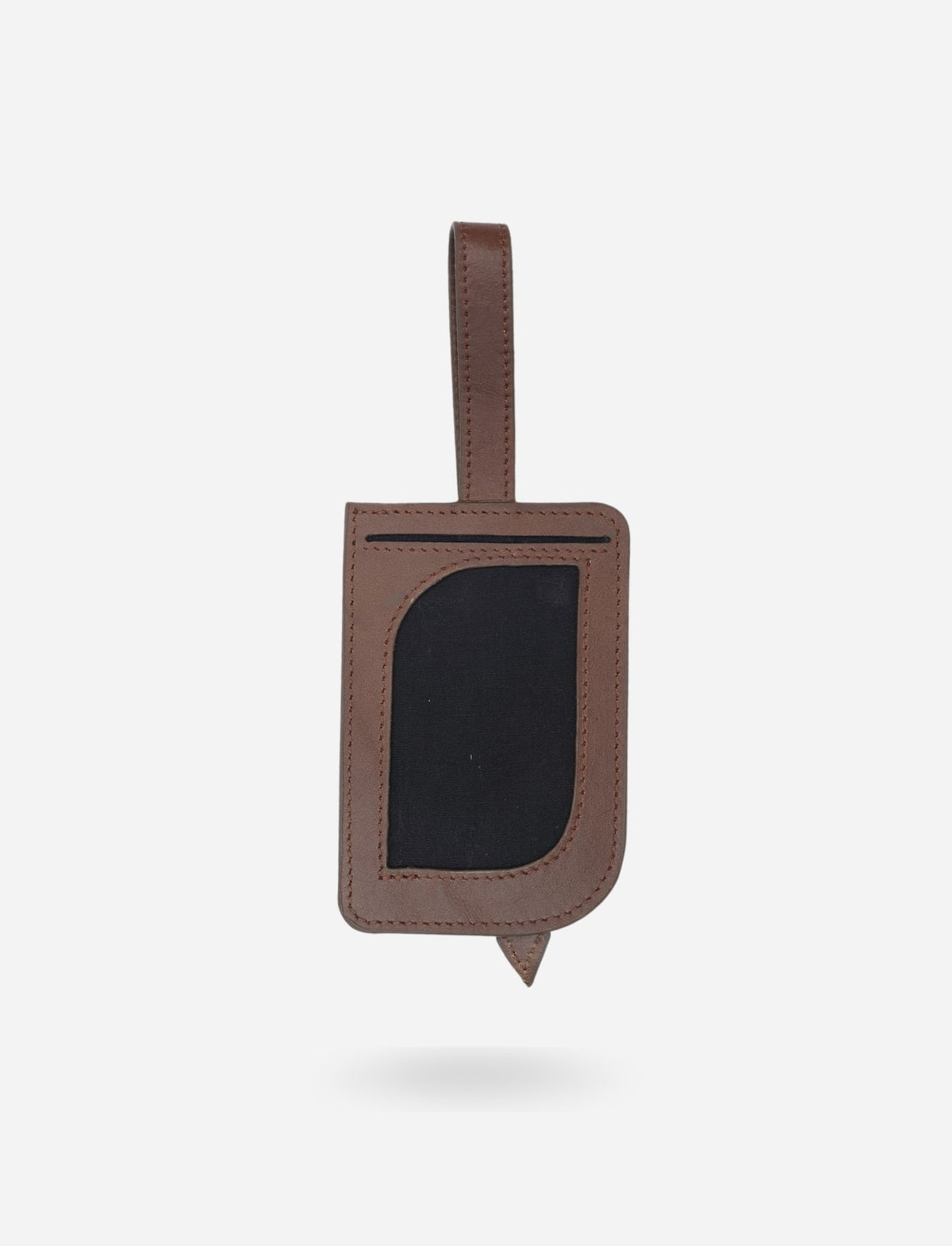 Timeless tan upcycled leather luggage tag with clear ID window and stitched strap on white background