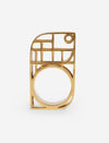 Modern gold metal ring with geometric openwork design on white background