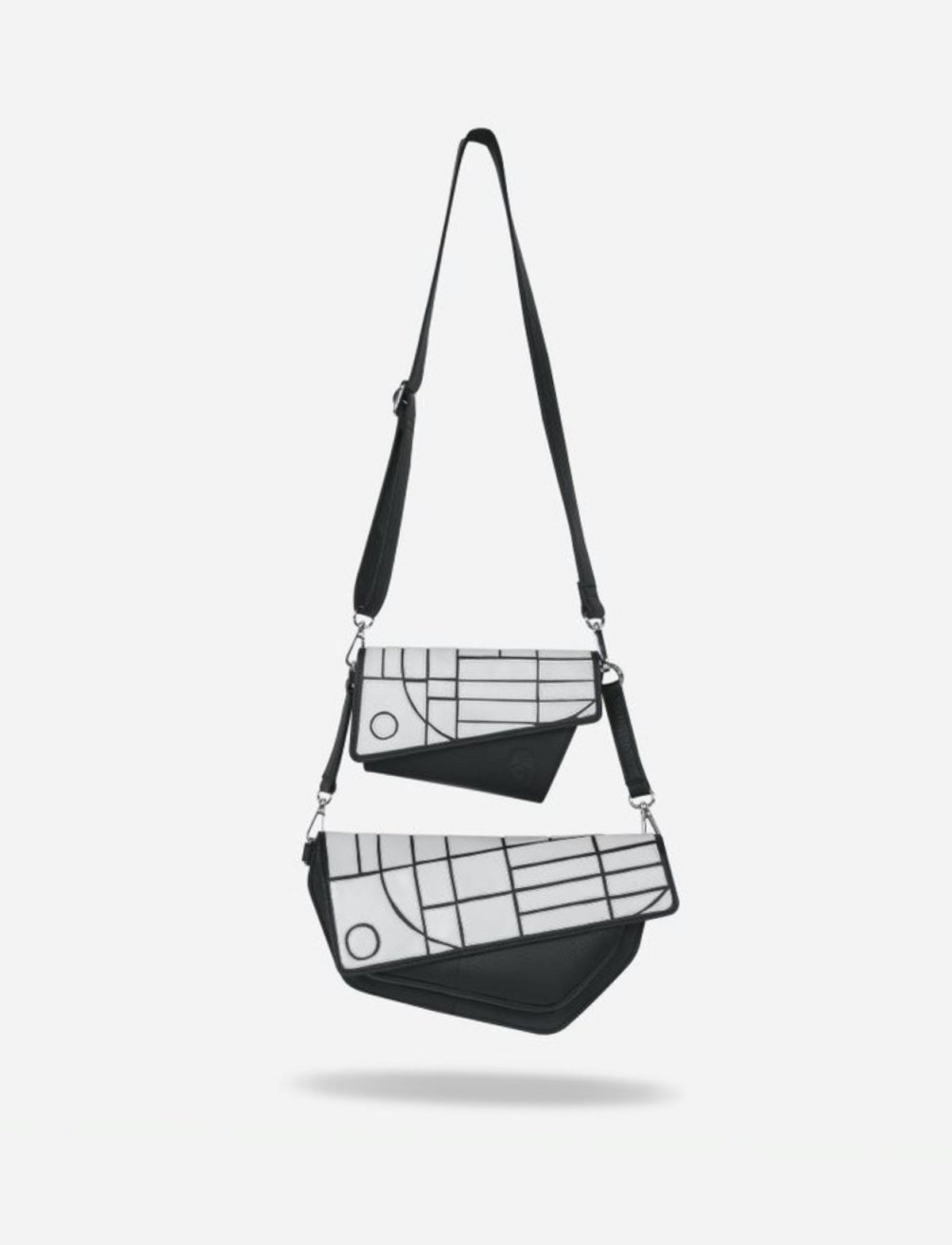 Two black and white crossbody bags with geometric patterns and detachable straps on white background