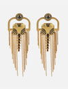 Pair of gold metal earrings with black enamel accents and multiple hanging chain tassels on white background