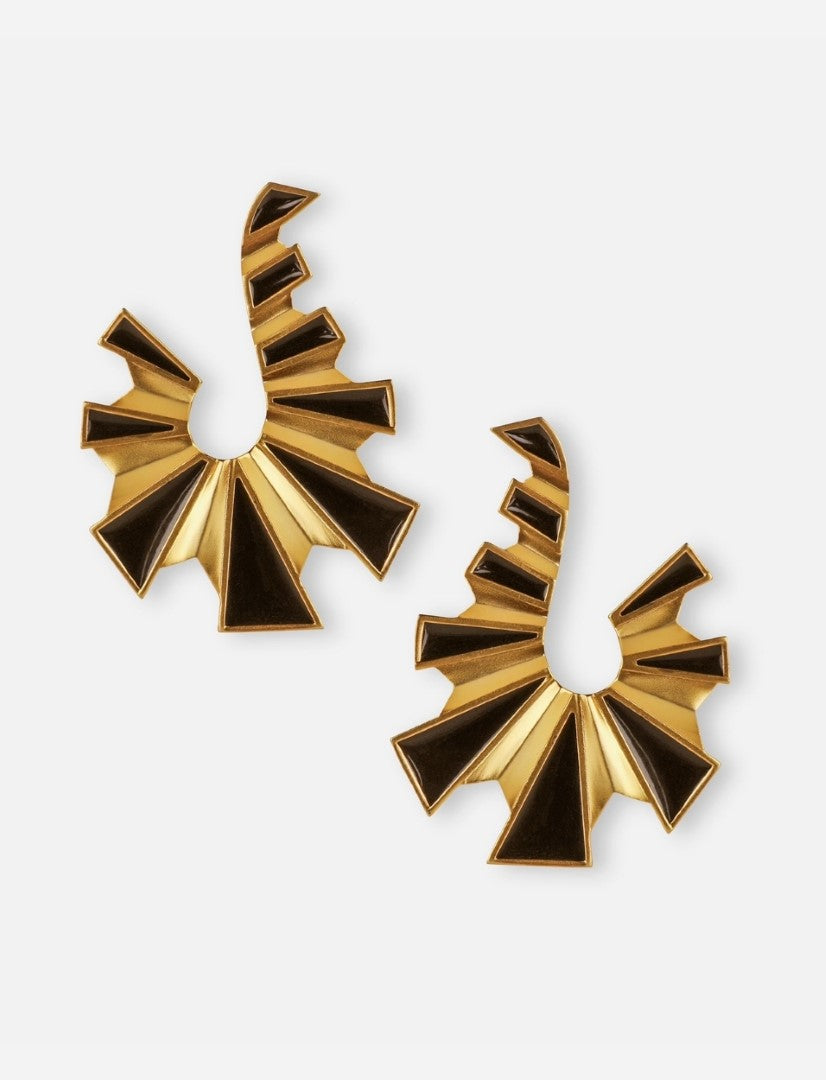 Pair of gold and black enamel metal earrings with geometric fan-shaped design on white background