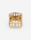 Gold metal ring with geometric cut-out pattern on white background