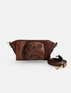 Timeless tan handcrafted leather wristlet bag with woven detailing and detachable strap on white background