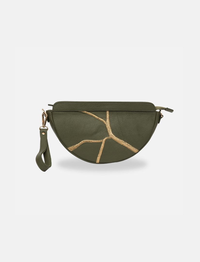 Green leather sling bag with gold embroidered crack design and detachable wrist strap