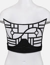 Back view of black and white upcycled leather corset with geometric applique on mannequin