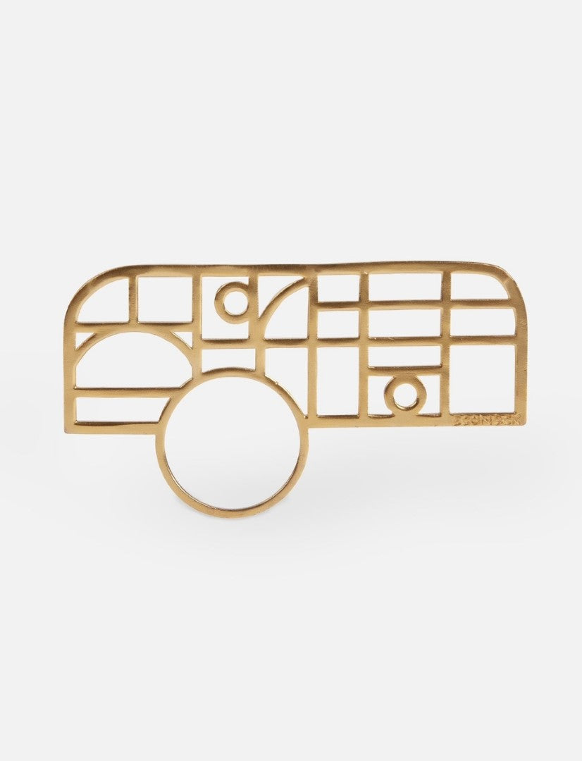 Gold metal ring with geometric grid design including circles and rectangles on white background