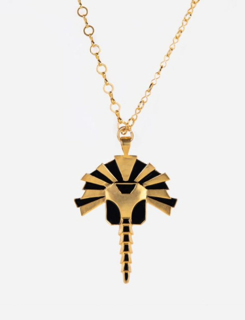 Gold and black enamel metal pendant necklace with an abstract tribal design and adjustable gold chain
