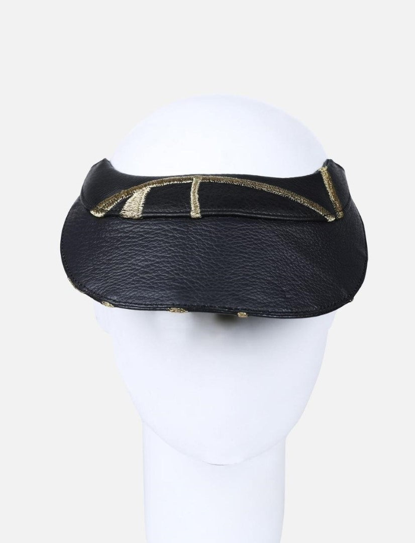 Black leather visor hat with gold embroidered details on mannequin head