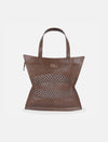 brown leather tote bag with woven central design and two top handles on white background