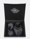 Open black gift box containing upcycled black leather jewelry and accessories by Econock