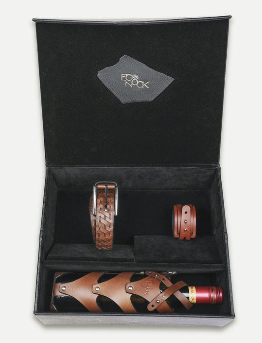 Black gift box with brown leather upcycled belt, bracelet, and wine bottle holder handcrafted in India