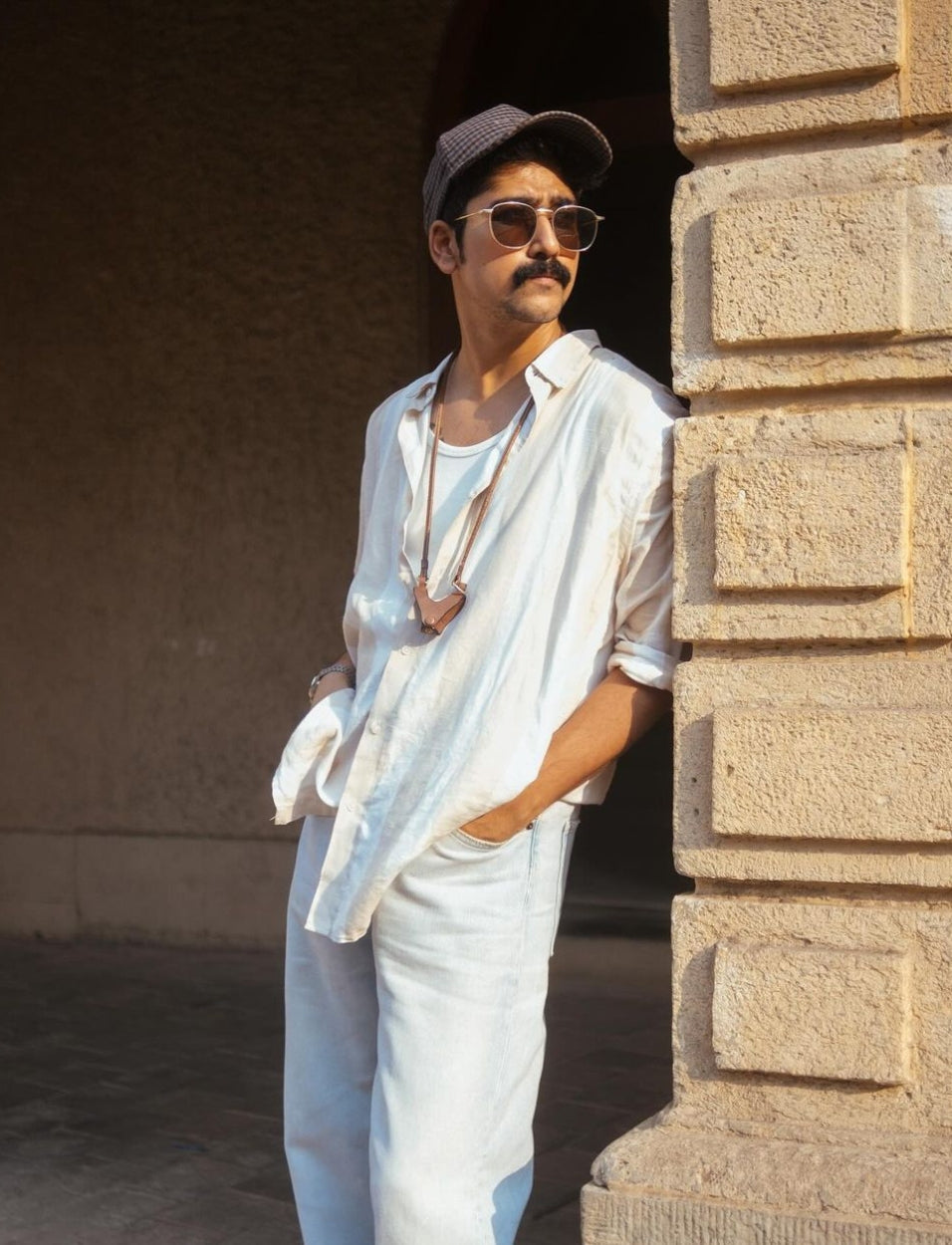 Designer Eyewear accessory Sunglass case holder white with lanyard worn on day event vacation