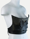 Black leather corset with gold embroidered sunburst design on white mannequin bust
