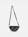 Black half-moon sling bag with gold crackle pattern and adjustable shoulder strap on white background