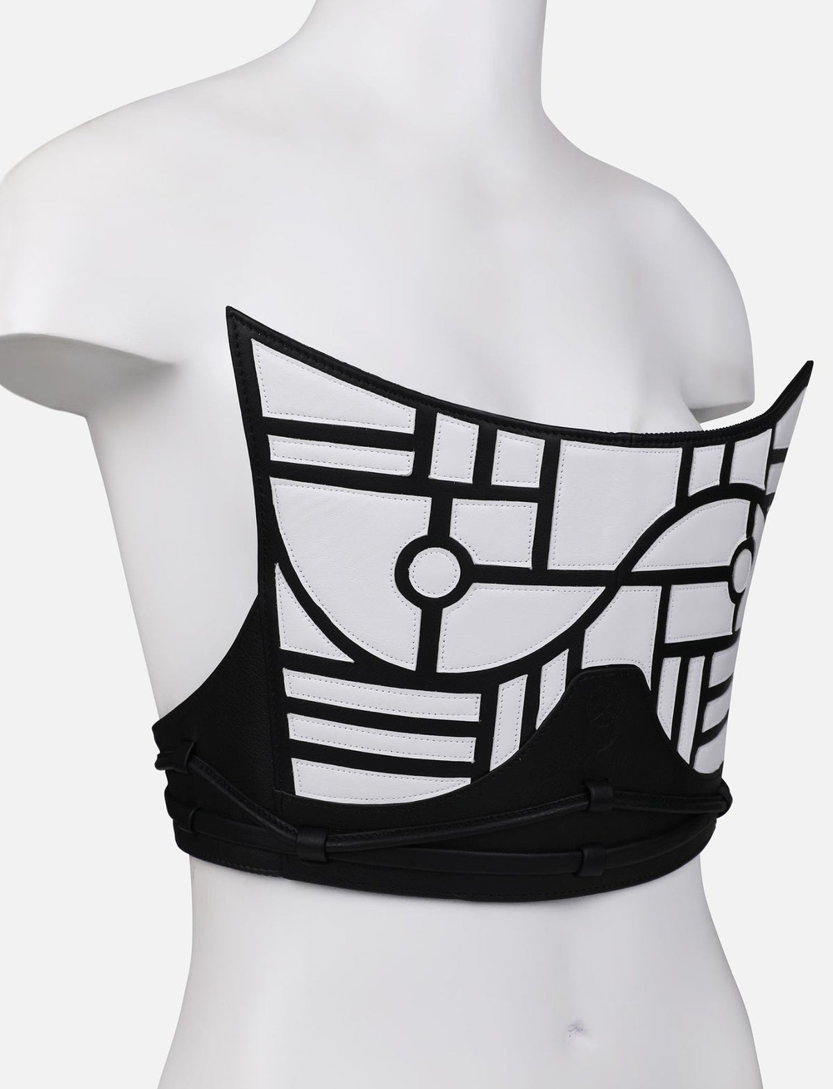 Black and white geometric applique leather corset on mannequin, handcrafted in India