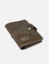 Timeless olive green upcycled leather passport cover with woven detail and Eco Nook logo