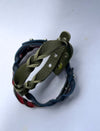 Close-up of two braided leather bracelets, one olive green and one dark blue with red accents, against a white background