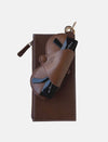 Timeless tan leather Jayden crossbody bag with upcycled belt detail and black Vogue cards