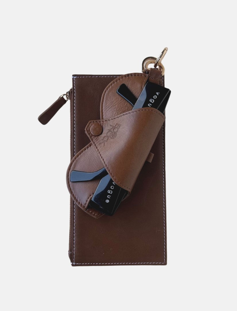 Timeless tan leather Jayden crossbody bag with upcycled belt detail and black Vogue cards