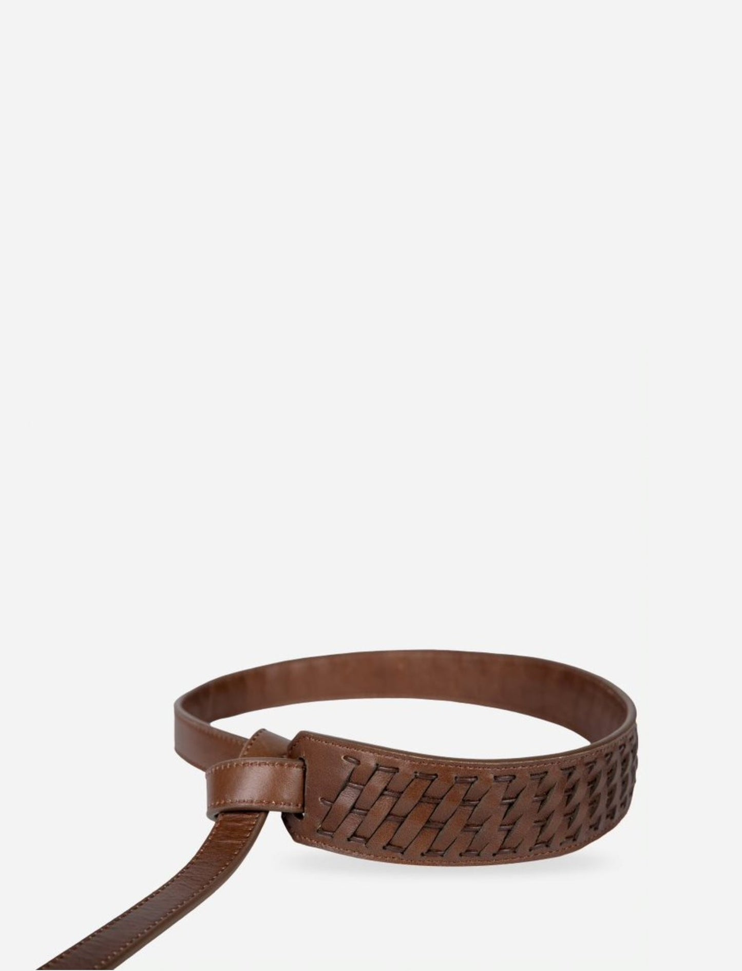 Handcrafted brown leather belt with woven design detail on plain background