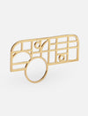 gold metal ring with an abstract geometric grid design on white background