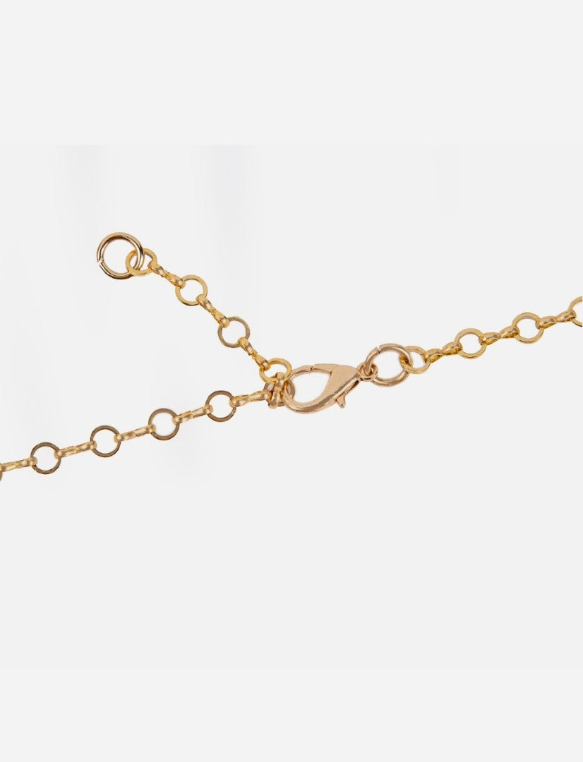 Close-up of gold chain necklace with round links and a lobster clasp fastener on white background