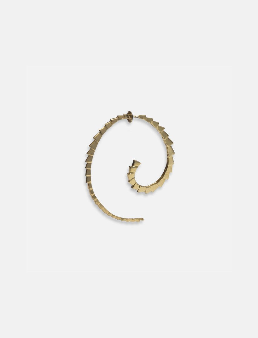 Single gold-toned spiral hoop earring with geometric textured segments on white background